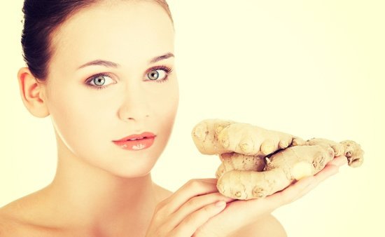 woman-with-whole-ginger-root.jpg